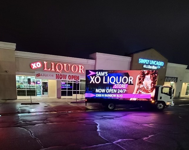 mobile digital billboard truck infront of XO liquor store 