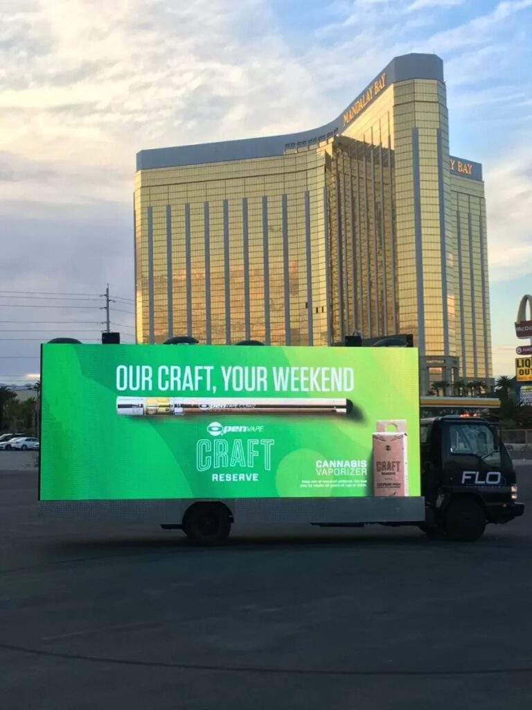 green ad on mobile billboard truck infront of mandalay bay casino in las vegas